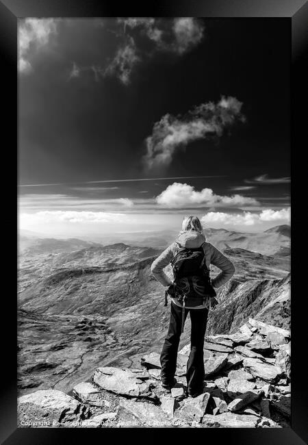 Young female hiker relaxing on mountain summit Wales Framed Print by Spotmatik 