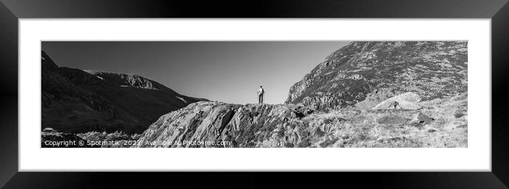 Panoramic rugged terrain of Snowdonia with female hiker Framed Mounted Print by Spotmatik 