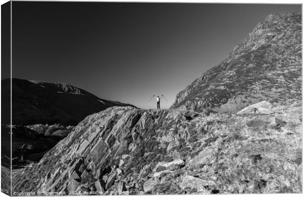 Scenic views across Snowdonia for happy female hiker Canvas Print by Spotmatik 