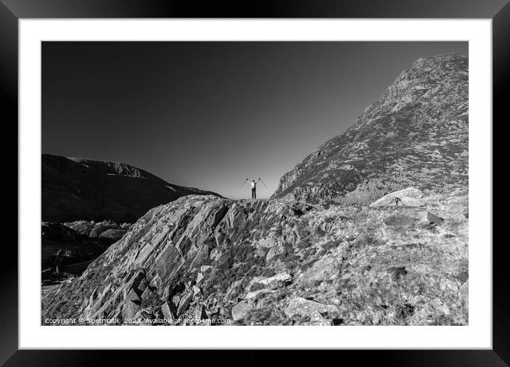 Scenic views across Snowdonia for happy female hiker Framed Mounted Print by Spotmatik 