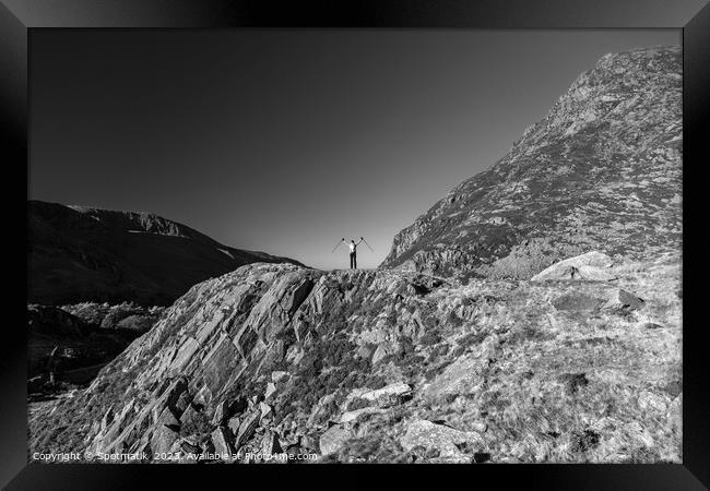 Scenic views across Snowdonia for happy female hiker Framed Print by Spotmatik 