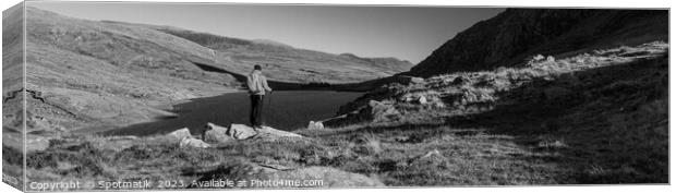 Panoramic lake Snowdonia National Park with female hiker Canvas Print by Spotmatik 