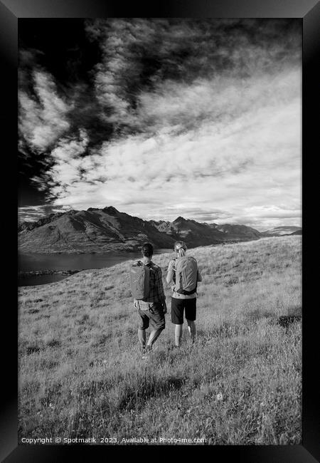 New Zealand trekking couple viewing Lake Wakatipu Otago Framed Print by Spotmatik 