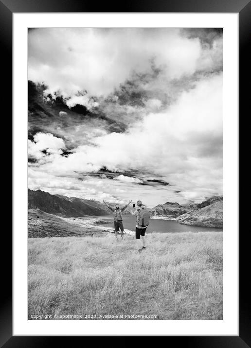 Queenstown girl taking smart phone picture New Zealand  Framed Mounted Print by Spotmatik 