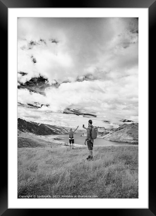 Young male taking picture of female friend Queenstown Framed Mounted Print by Spotmatik 