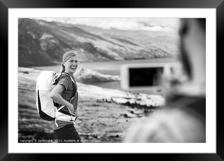 Young male taking picture of happy female Queenstown Framed Mounted Print by Spotmatik 