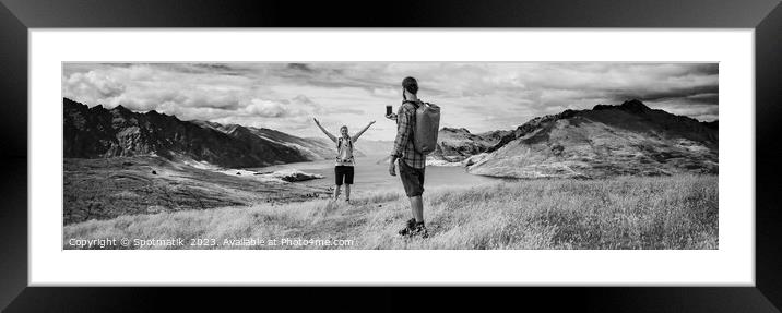 Panorama of young backpacking couple taking smartphone picture Framed Mounted Print by Spotmatik 