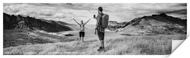 Panorama of young backpacking couple taking smartphone picture Print by Spotmatik 