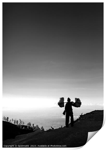 Indonesian worker carrying sulphur blocks from volcano Rim  Print by Spotmatik 