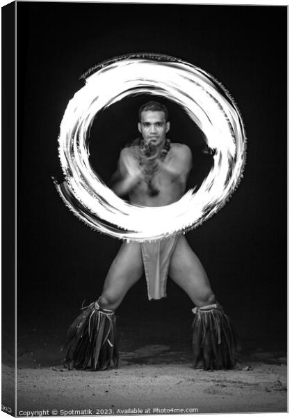 Male Fire dancer with illuminated spinning flaming torch  Canvas Print by Spotmatik 