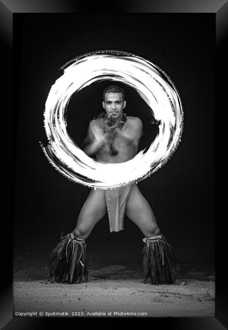 Male Fire dancer with illuminated spinning flaming torch  Framed Print by Spotmatik 