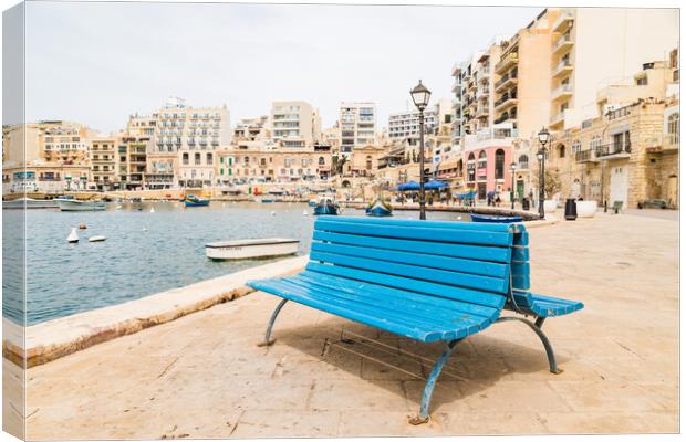Blue bench on the promenade at Spinola Bay Canvas Print by Jason Wells