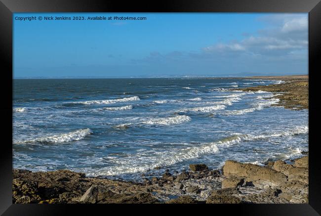 A view across Rest Bay Porthcawl on a breezy cold January winter day Framed Print by Nick Jenkins