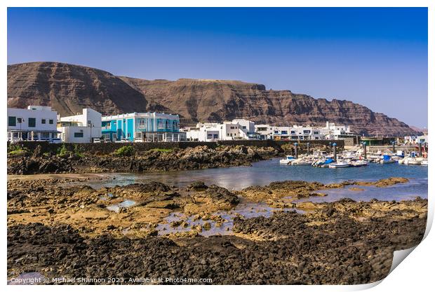 Seafront buildings in the seaside village of Orzol Print by Michael Shannon