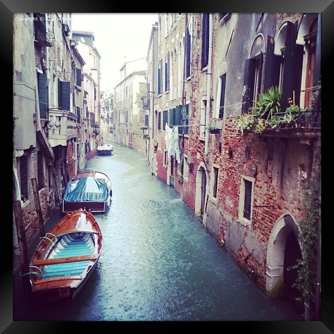 Boats in a small canal in Venice during a rainy day in Autumn Framed Print by Kristof Bellens