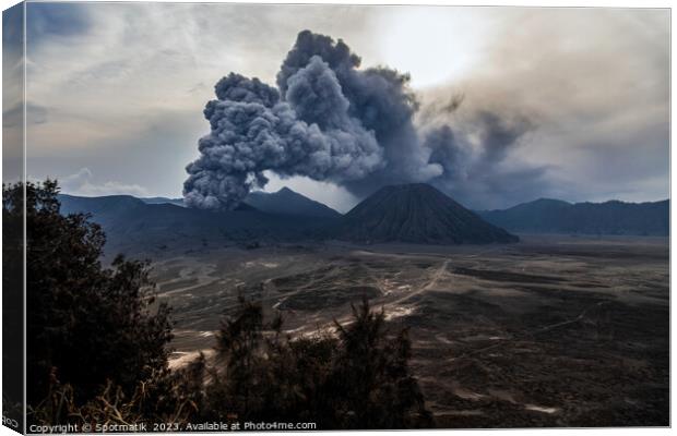 Indonesia ash cloud from active Mount Bromo volcano  Canvas Print by Spotmatik 