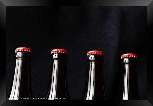 A row of red top beer bottles Framed Print by Imladris 