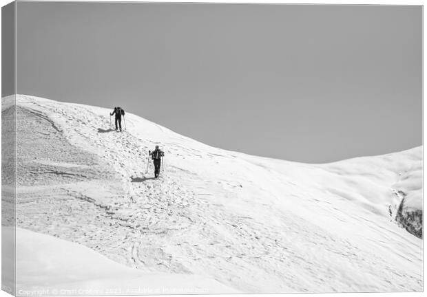 Two Hikers on a trail walking through snow. Winter landscape in Carapathian Mountains, Romania. Canvas Print by Cristi Croitoru