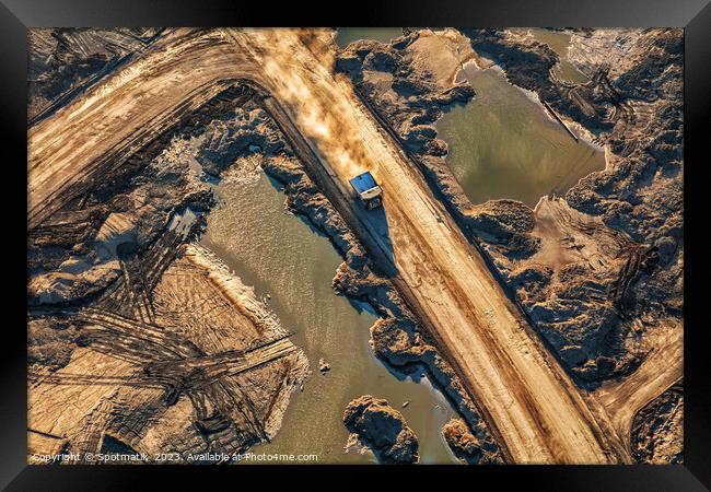 Aerial giant dump trucks Athabasca Tar sand site  Framed Print by Spotmatik 