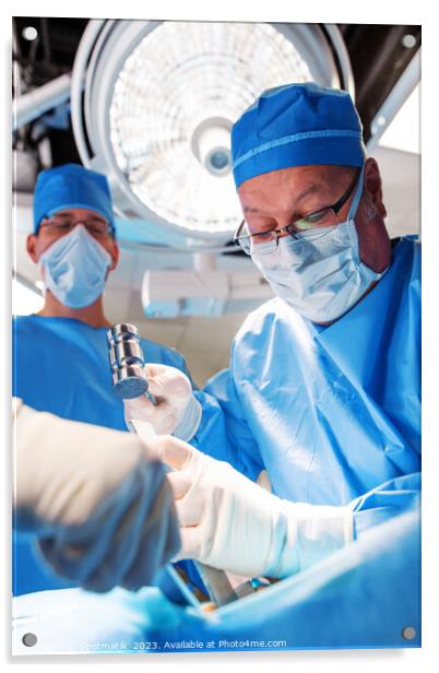 Medical surgeon operating on patient under overhead light Acrylic by Spotmatik 