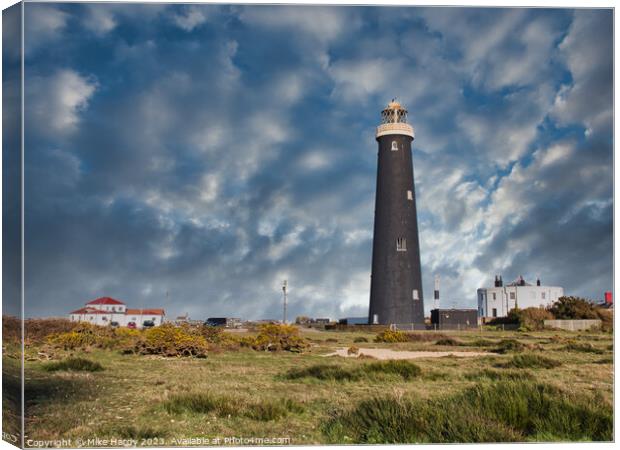 Dungeness Lighthouses under moody skies. Canvas Print by Mike Hardy