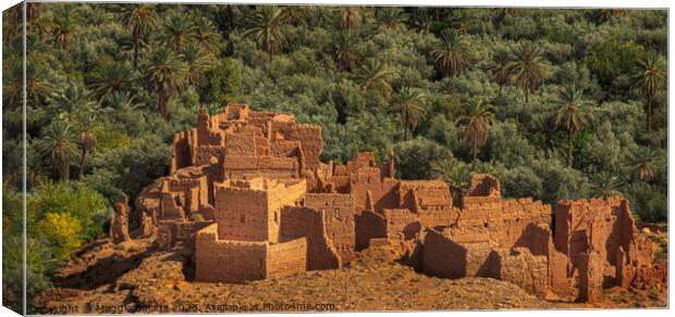 Brown Stone Fortress ruins with Green Palm Trees, Morocco. Canvas Print by Maggie Bajada