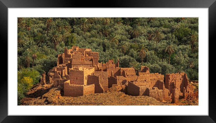Brown Stone Fortress ruins with Green Palm Trees, Morocco. Framed Mounted Print by Maggie Bajada
