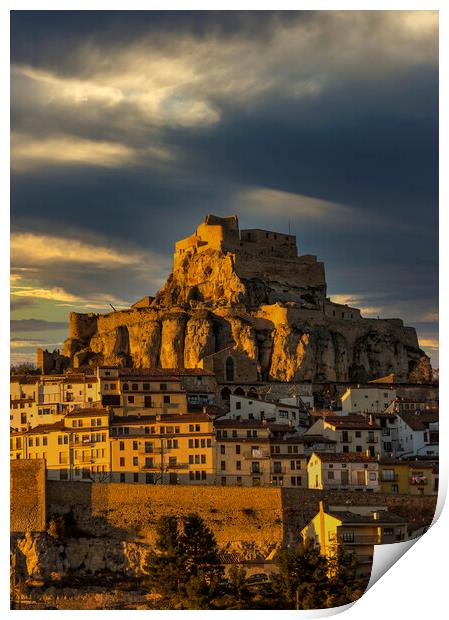 Photography with the town and castle of Morella on the hill under the clouds Print by Vicen Photo