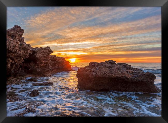 Photography with a sunrise between the rocks in a seascape Framed Print by Vicen Photo