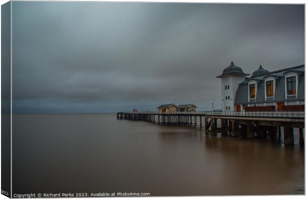 Dramatic Storm Clouds Engulf Penarth Pier Canvas Print by Richard Perks