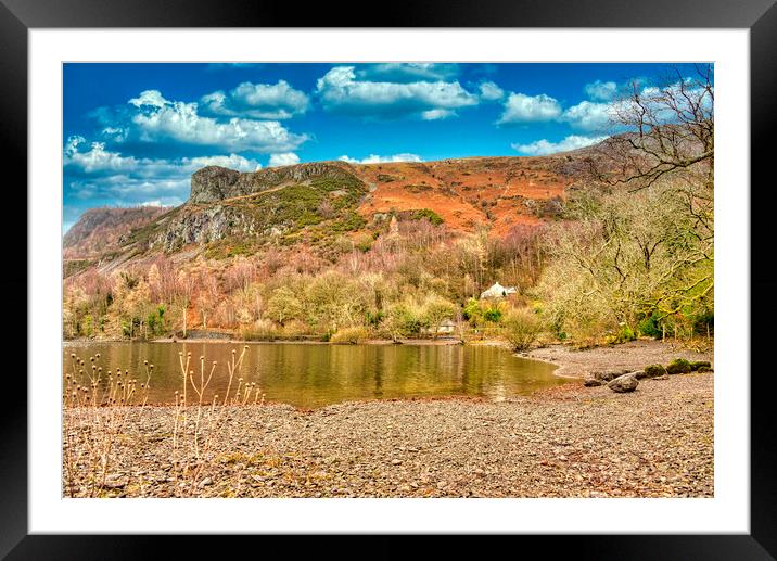 A body of water with a mountain in the background Framed Mounted Print by simon cowan