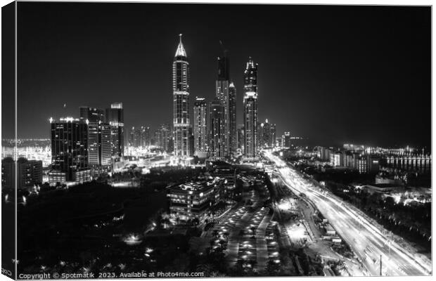 Night Dubai illuminated view of modern city Skyscrapers Canvas Print by Spotmatik 