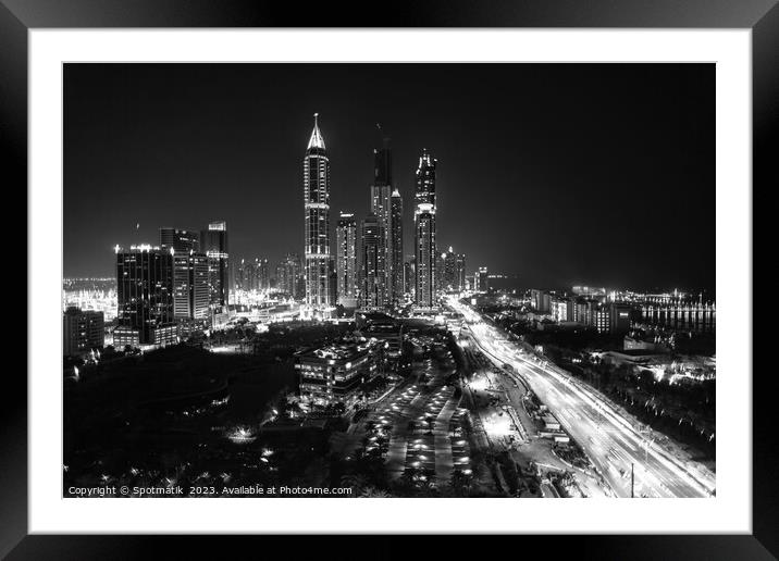 Night Dubai illuminated view of modern city Skyscrapers Framed Mounted Print by Spotmatik 