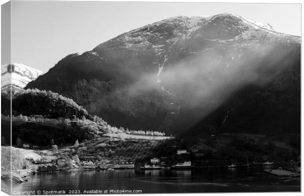 Norwegian sunlight beaming though light mist glacial fjord  Canvas Print by Spotmatik 