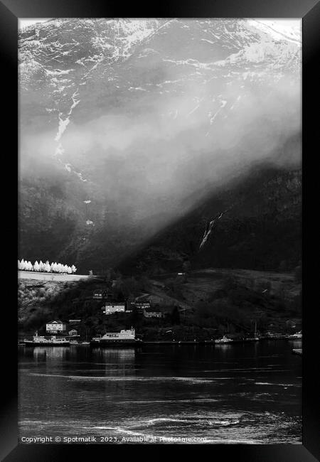 Sunlight beaming through light mist Norwegian glacial fjord  Framed Print by Spotmatik 