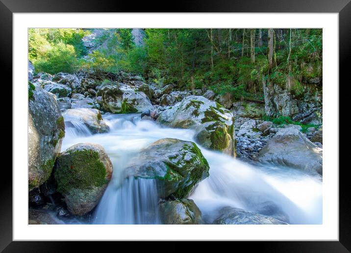 A large waterfall next to a rock Framed Mounted Print by Balázs Tóth