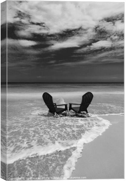 Red chairs on shoreline of sandy beach Bahamas Canvas Print by Spotmatik 
