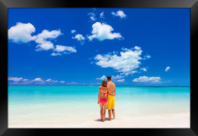 Happy Caucasian couple together on beach holiday Caribbean Framed Print by Spotmatik 
