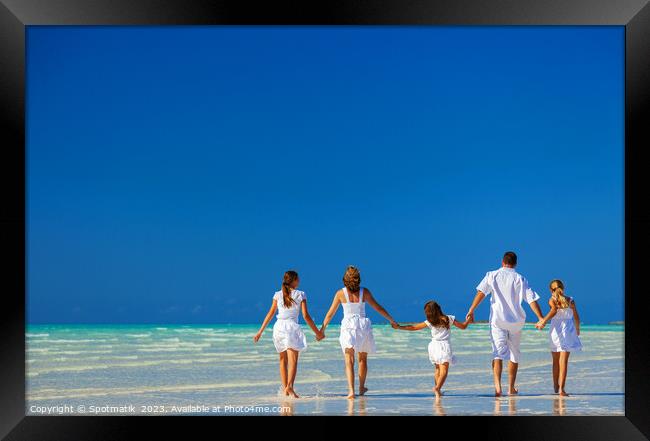 Happy Caucasian family on tropical beach enjoying leisure Framed Print by Spotmatik 