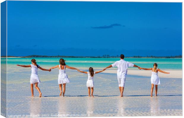 Healthy Caucasian family together on beach vacation Bahamas Canvas Print by Spotmatik 