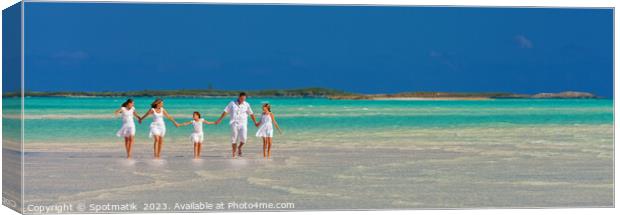 Panorama of mother father with family walking on beach  Canvas Print by Spotmatik 