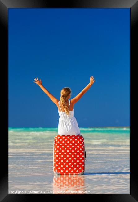 Blonde female teenager on beach sitting on suitcase Framed Print by Spotmatik 