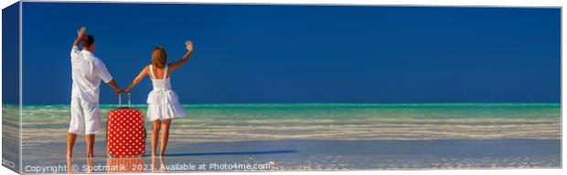 Panoramic of young couple vacationing Bahamas ocean beach Canvas Print by Spotmatik 