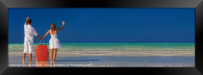 Panoramic of young couple vacationing Bahamas ocean beach Framed Print by Spotmatik 