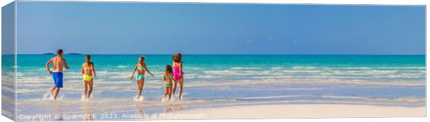 Panorama Caucasian parents and daughters Caribbean beach Canvas Print by Spotmatik 