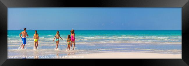 Panorama Caucasian parents and daughters Caribbean beach Framed Print by Spotmatik 