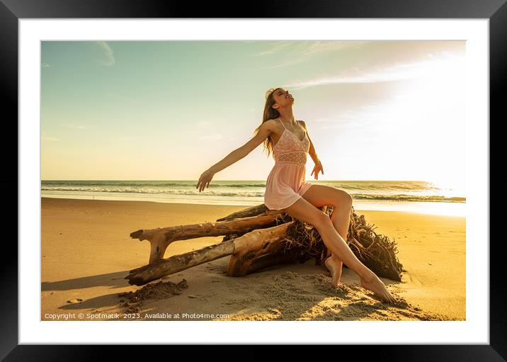 Young Caucasian girl enjoying sun sitting on driftwood  Framed Mounted Print by Spotmatik 