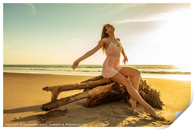Young Caucasian girl enjoying sun sitting on driftwood  Print by Spotmatik 