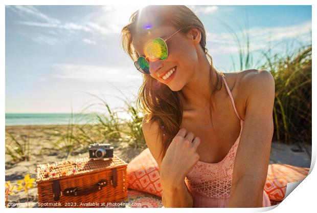 Smiling Caucasian girl relaxing on blanket at beach Print by Spotmatik 