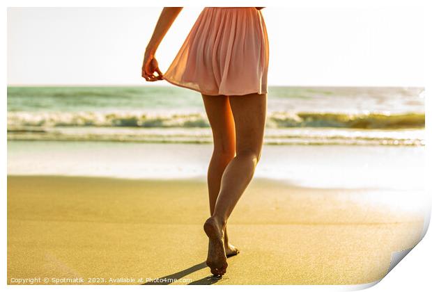 Young girl enjoying solo beach vacation at sunset Print by Spotmatik 